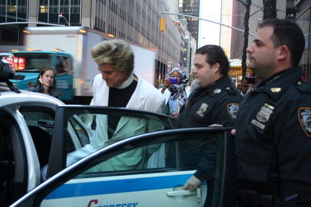 Rev. Billy being arrested outside UBS on Friday